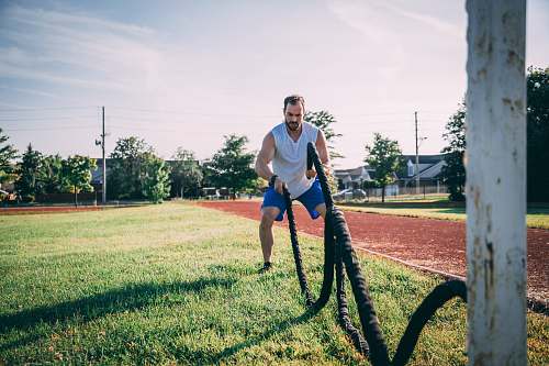human man doing rope exercise person