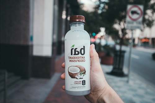 drink person holding Bai antioxidant cocofusion drink bottle healthy