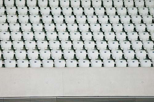 london white seats with gray concrete platform london aquatics centre (stop j)
