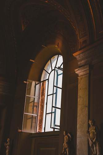 person brown stone building window