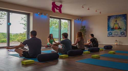 person five persons doing yoga inside room exercise