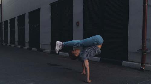 person man doing handstand man