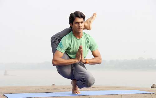person man doing yoga people