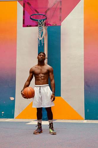 person man holding basketball apparel