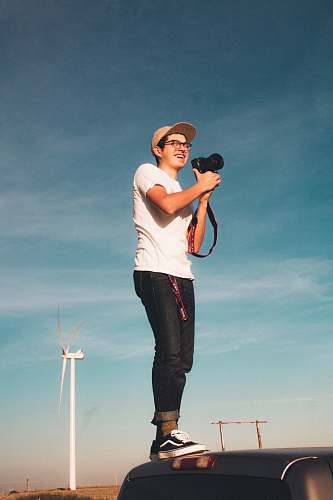 person man holding camera people
