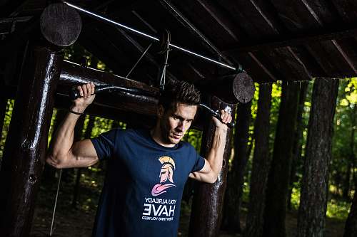 people man holding latpull down machine person