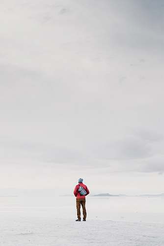person man in red jacket grey