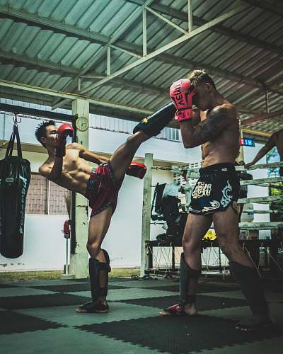 person man kicking man's head sport