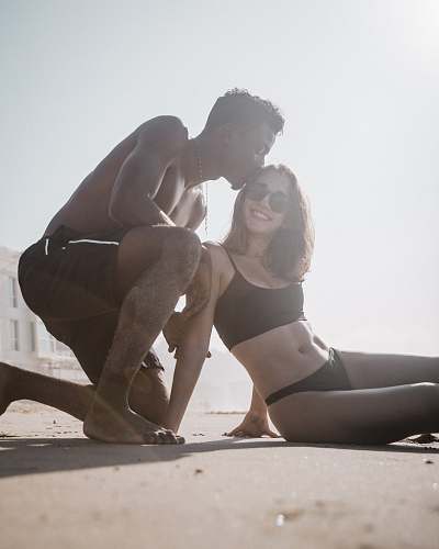 person man kisses woman make out