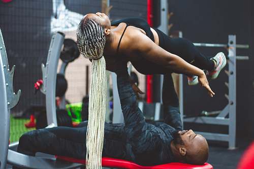 person man lifting woman working out