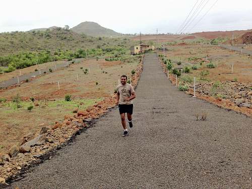 person man running during daytime fitness