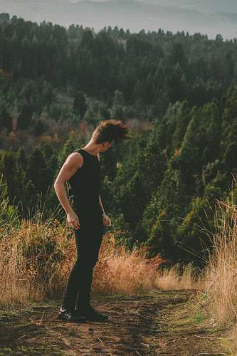 person man standing on field apparel