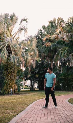 person man standing on pathway apparel
