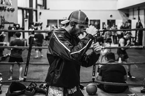 person man wearing jacket in ring black-and-white