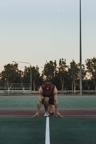 person man wearing red sleeveless shirt sports