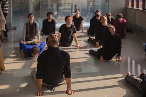 person people doing exercise on floor qom