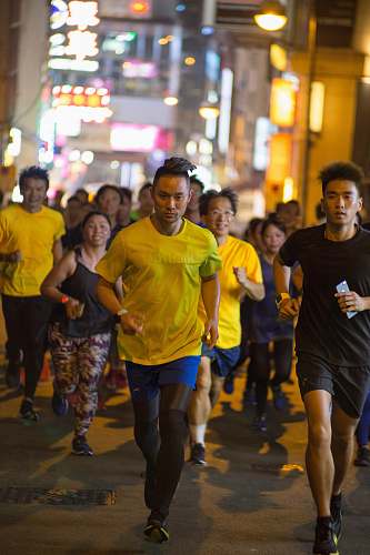 person people running near building shoe