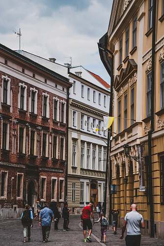 person people walking near buildings building