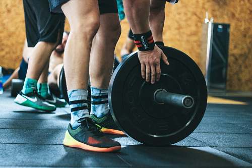 person person about to lift the weight plate people