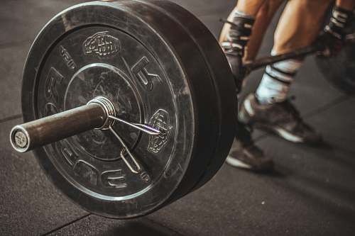 person person holding barbell people