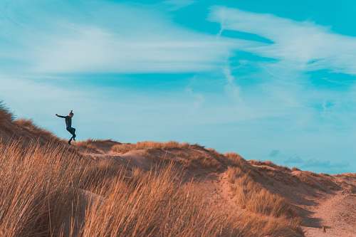 nature person on brown terrain outdoors