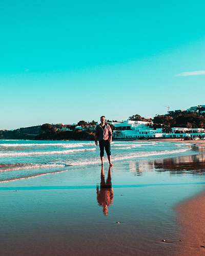 person person standing on shoreline nature