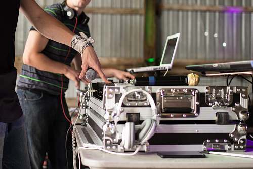 person person using DJ turntable people