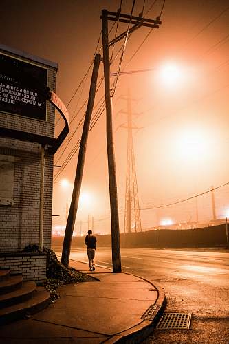 person person walking beside road flare