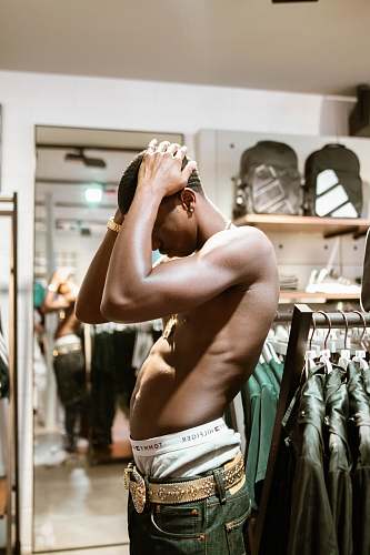 person standing man wearing gray denim bottoms apparel