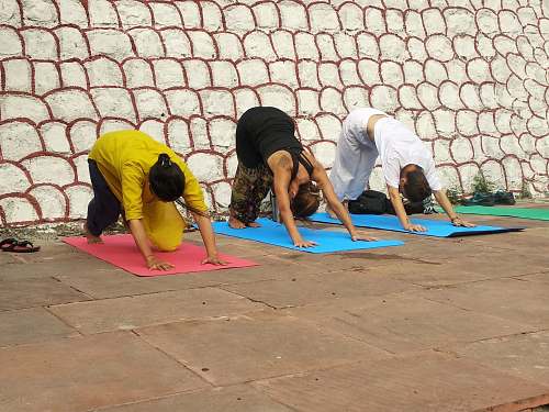 person three people doing yoga poses sports