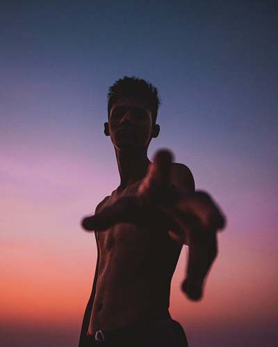 person topless man during golden hour sports