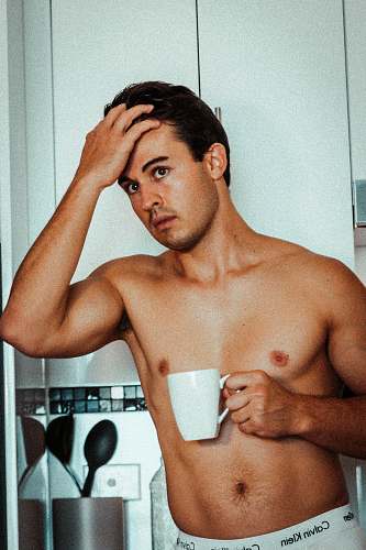person topless man with mug face