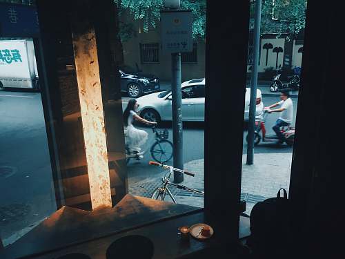 person woman biking near store machine