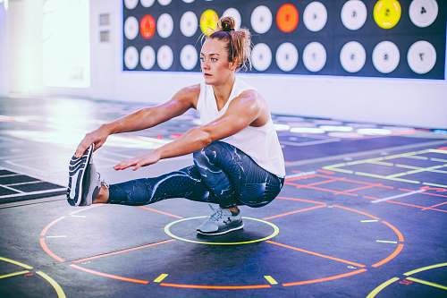 person woman doing stretching with legs sport