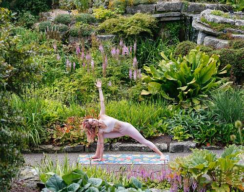 person woman doing yoga during daytime vase