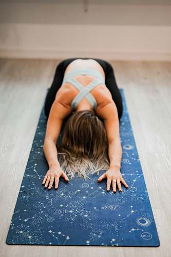 person woman doing yoga stretch