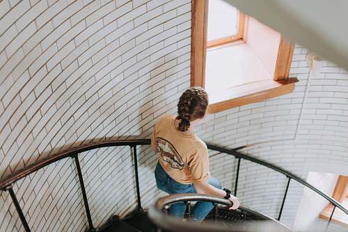 person woman going downstairs people