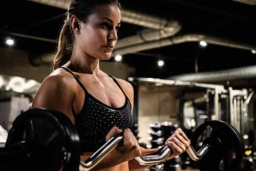 person woman in black sports bra sports