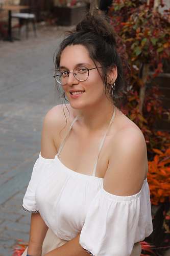 person woman in white off-shoulder dress smiling apparel