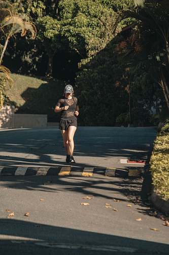 person woman jogging in park during daytime sports