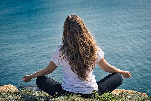 person woman looking at sea grass