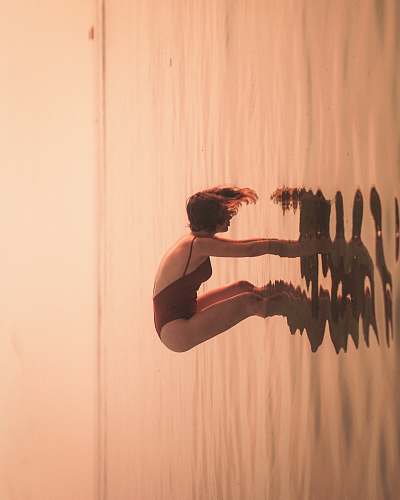 person woman on body of water during daytime water