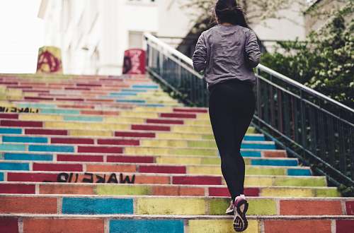 person woman running upstair in room people