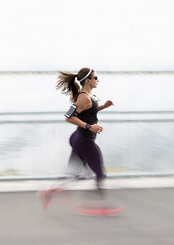 fitness woman running wearing armband people