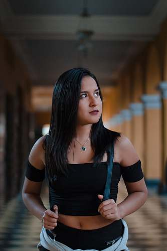 person woman standing inside structure people