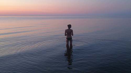 person woman standing on body of water people
