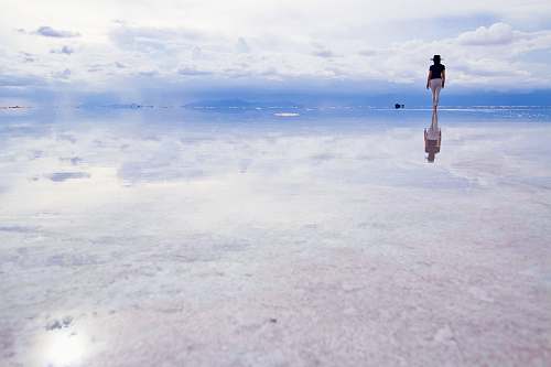 person woman standing on water during daytime nature