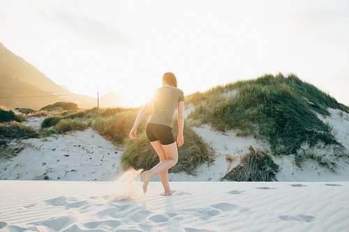 person woman standing on white stand during golden hour exercise