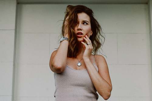 person woman touching her face people