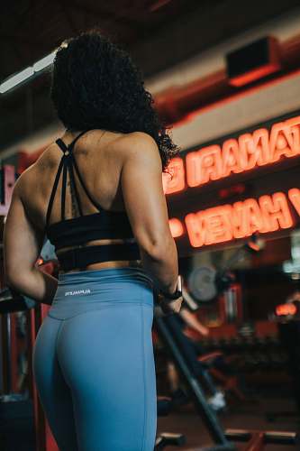 person woman wearing blue leggings fitness